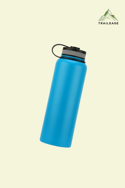 Blue hiking/camping water bottle with black cap on a beige background, featuring the Trailease brand logo.